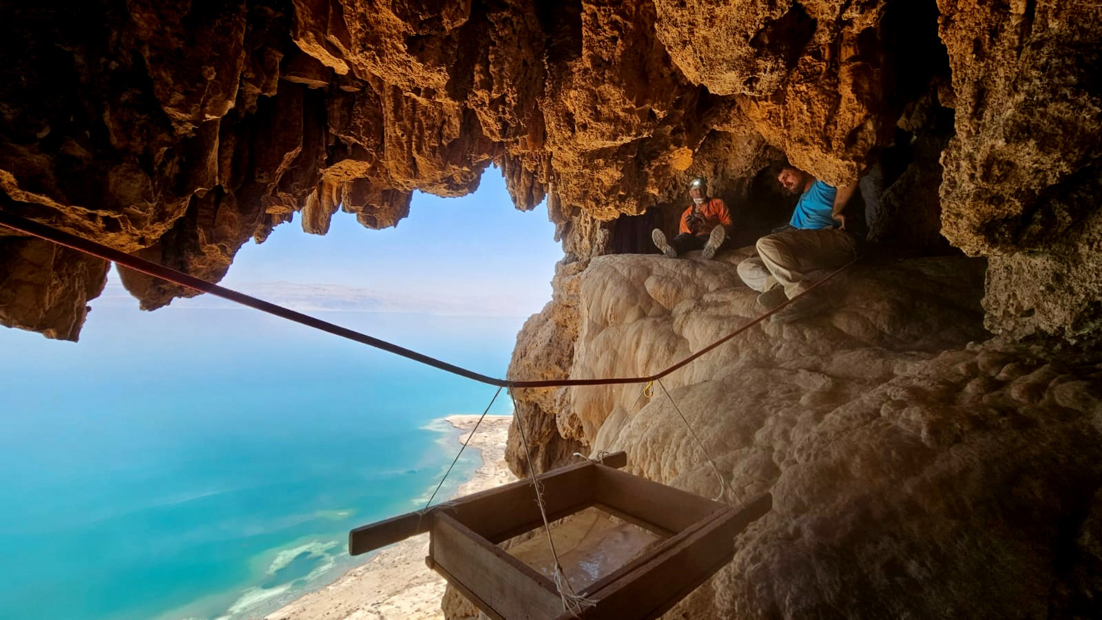 Archaeologists work in a cave above the Dead Sea in eastern Israel in Aug. 2023. Photo by Oriya Amichai, Israel Antiquities Authority