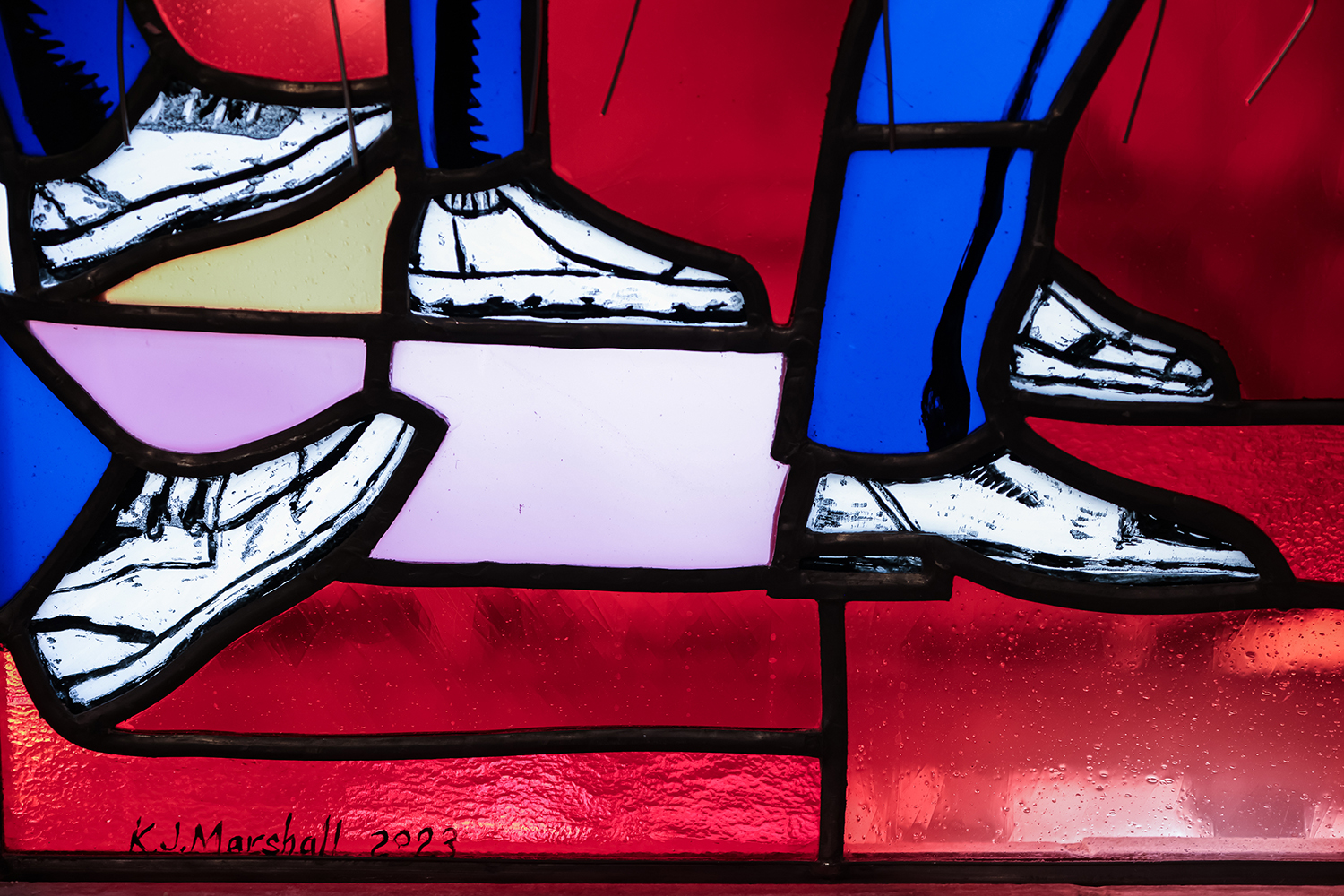 Kerry James Marshall signed and dated the new window's which can be spotted below the shoes in one of the four complete panel's he designed and created (?). Photo courtesy of Washington National Cathedral