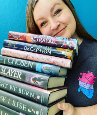 Novelist Kiersten White holds a number of her books. Courtesy photo