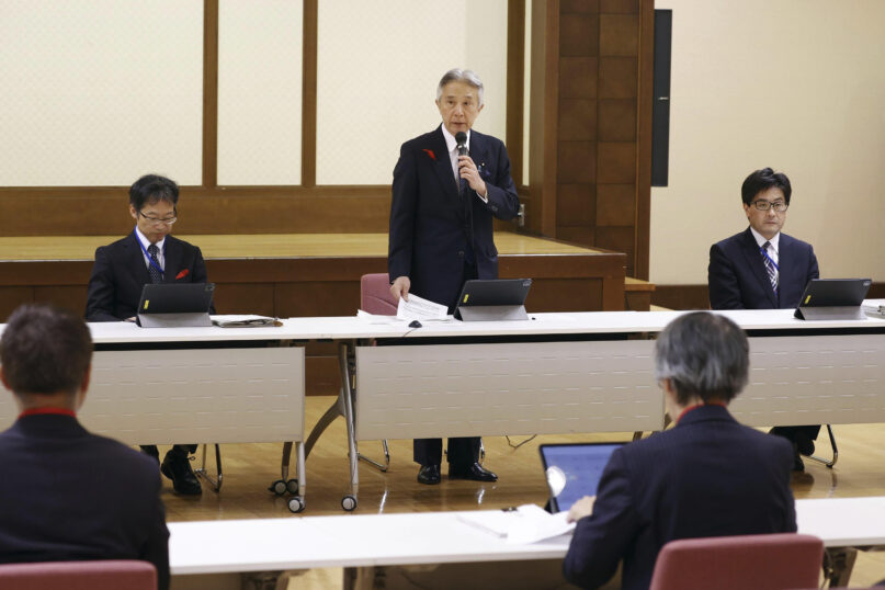 Japan's Education Minister Masahito Moriyama, center, speaks during a press conference in Tokyo Thursday, Oct. 12, 2023. Japan’s government is convening a religious affairs council on Thursday to ask experts to decide whether to seek a court order to revoke the legal status of the Unification Church. The church's fundraising tactics and cozy ties with the governing party have triggered public outrage. (Kyodo News via AP)