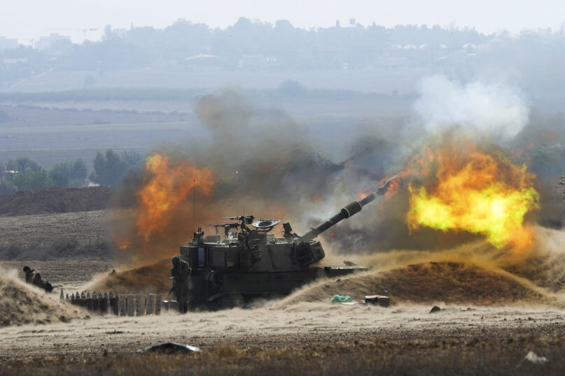 An Israeli mobile artillery unit fires a shell from southern Israel toward the Gaza Strip, in a position near the border, Oct. 11, 2023. (AP Photo/Erik Marmor)