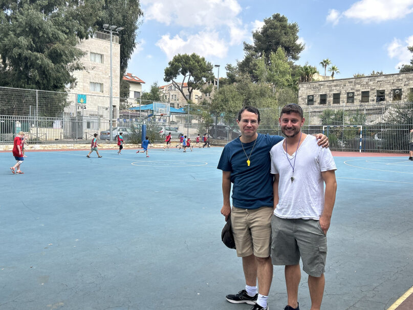 Aaron Youngerwood, left, and Avner Engel organized a soccer match for Jerusalem children to distract them from the unfolding Hamas-Israel war. They chose the location due to the field's proximity to a bomb shelter. Photo by Michele Chabin