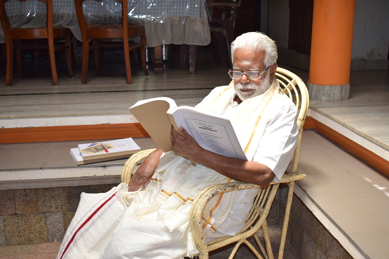 Govindan Gopalakrishnan reads his book "Njan Kanda Quran," his own interpretation of the Quran, at his home in Trivandrum, Kerala, southern India, Oct. 9, 2023. (RNS photo/Priyadarshini Sen)