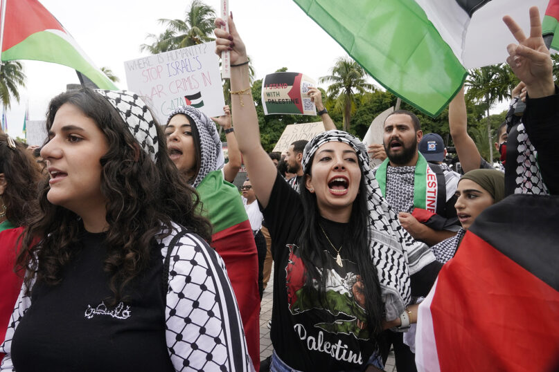 Palestinian supporters rally for Palestinians in Gaza, Friday, Oct. 13, 2023, in Miami.  For Palestinian Americans, there’s a sense of helplessness and hopelessness as many struggle to hear from their families in Gaza. Amid a fuel and water shortage, no electricity, and now a forced evacuation in the north, administering and sending aid to civilians in Gaza is near impossible. (AP Photo/Marta Lavandier, File)