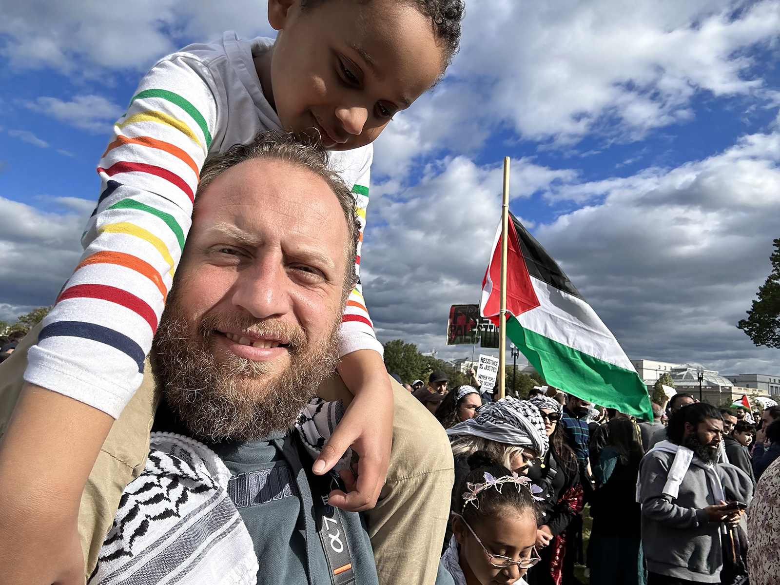 Anwar Arafat holds his youngest son while attending a demonstration in support of Palestinians, Friday, Oct. 20, 2023, in Washington, D.C. Photo courtesy Arafat