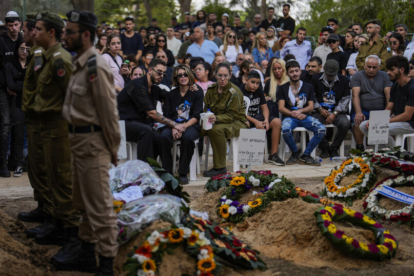 Mourners attend the funeral of Israeli soldier Abraham Cohen at the Mount Herzl cemetery in Jerusalem, Oct. 12, 2023. (AP Photo/Francisco Seco)