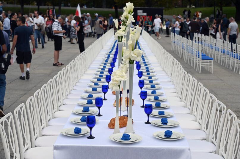 Advocates erect empty Shabbat tables in support of hostages taken by Hamas