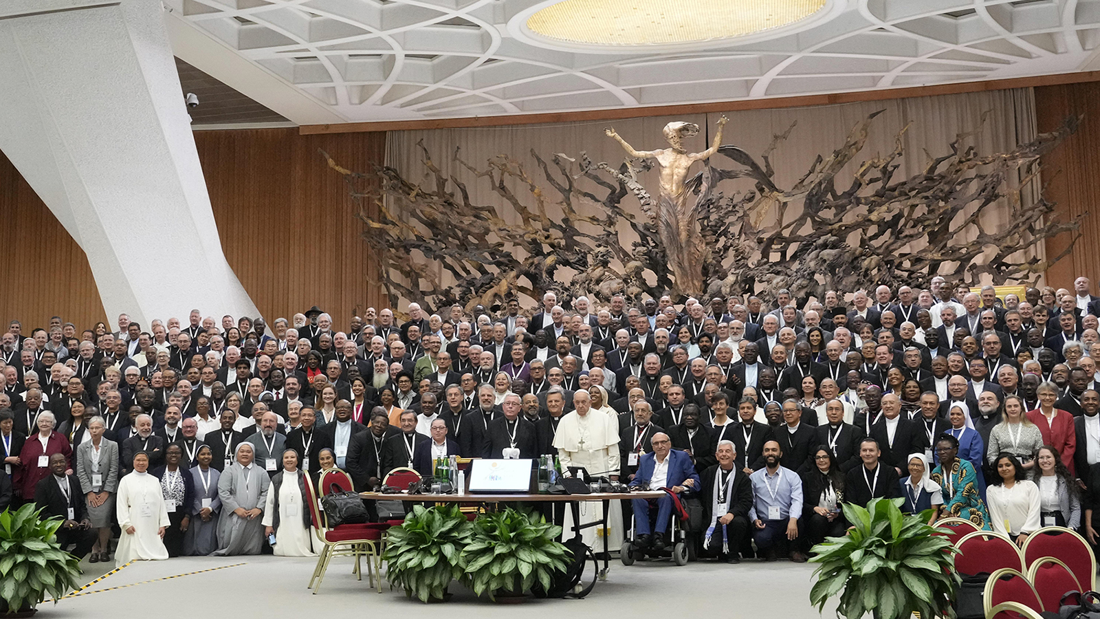 Pope Francis poses for a picture with participants of the Synod of Bishops’ 16th General Assembly in the Paul VI Hall at the Vatican, Oct. 23, 2023. (AP Photo/Gregorio Borgia)