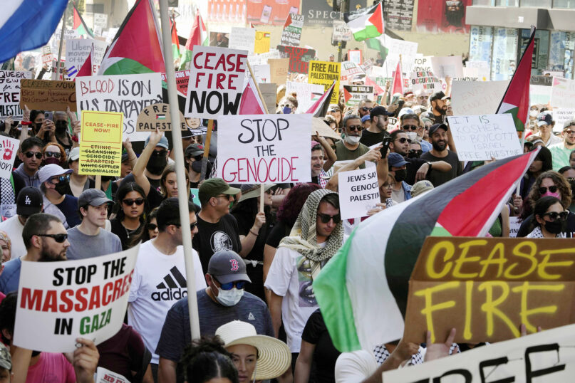 People participate during a pro-Palestinian march calling for a cease-fire in Gaza, Saturday, Oct. 21, 2023, downtown Los Angeles. (AP Photo/Damian Dovarganes)