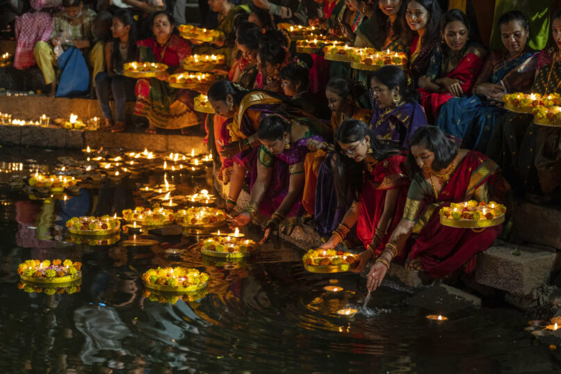FILE - Hindu women light oil lamps at the Banganga pond as they celebrate Dev Diwali festival in Mumbai, India, Nov. 7, 2022. Diwali is the most important festival of the year in India and for Hindus in particular. It is celebrated across faiths by more than a billion people in the world’s most populous nation and the diaspora. This year, Diwali begins Friday, Nov. 10, 2023, and the festival will be observed on Sunday, Nov. 12. (AP Photo/Rafiq Maqbool, File)