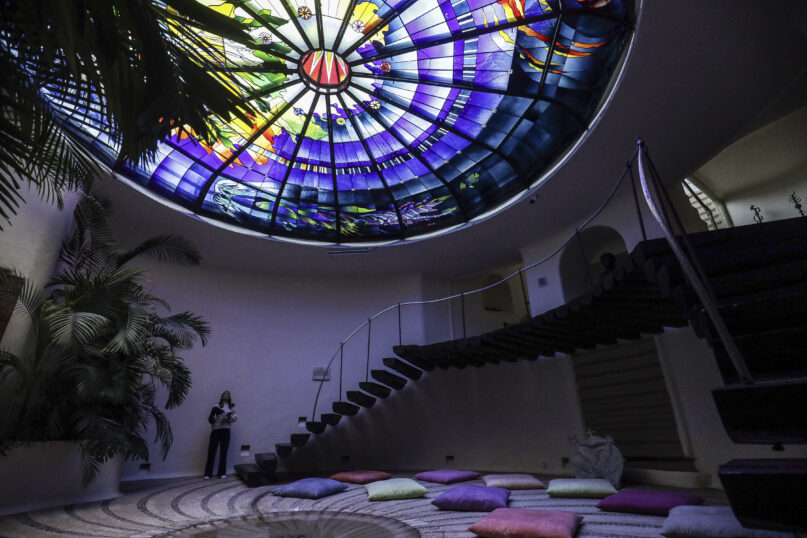 A stained-glass dome titled The Second Innocence, the Dream of Dionisyos, by Italian artist Narcissus Quagliata decorates the El Santuario Resort hotel in Valle de Bravo, Mexico, Wednesday, Oct. 25, 2023. Over the last five decades, Quagliata has created these stained-glass artworks for sacred spaces, private homes and public exhibitions, using a fusible glass technique. (AP Photo/Ginnette Riquelme)