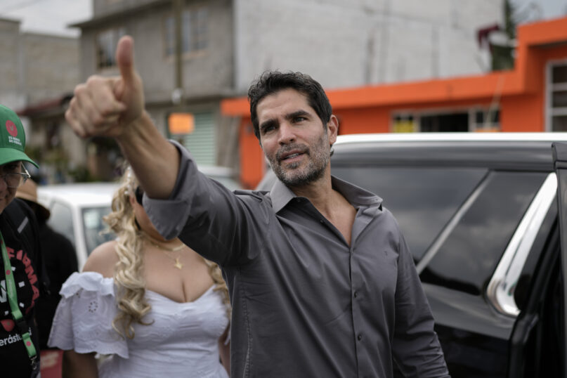 Presidential hopeful Eduardo Verastegui flashes a thumbs up at supporters during a rally to collect signatures to enable him to run as an independent candidate in the 2024 presidential election, in San Bartolo del Valle, Mexico, Friday, Nov. 10, 2023. Rallying all over the country to fulfill the task of gathering 1 million signatures by early January, the 49-year-old right-wing activist has ignited controversy in this deeply Catholic nation, where abortion activists and the LGBTQ+ community lead advocacy campaigns of their own.(AP Photo/Eduardo Verdugo)