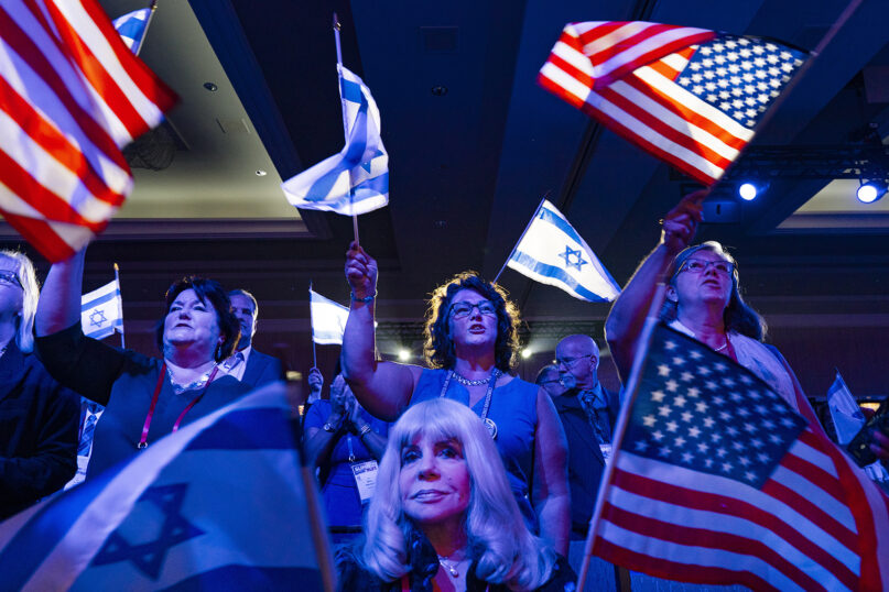 A crowd of mostly Evangelical Christians wave U.S. and Israeli flags during the Christians United For Israel (CUFI) 