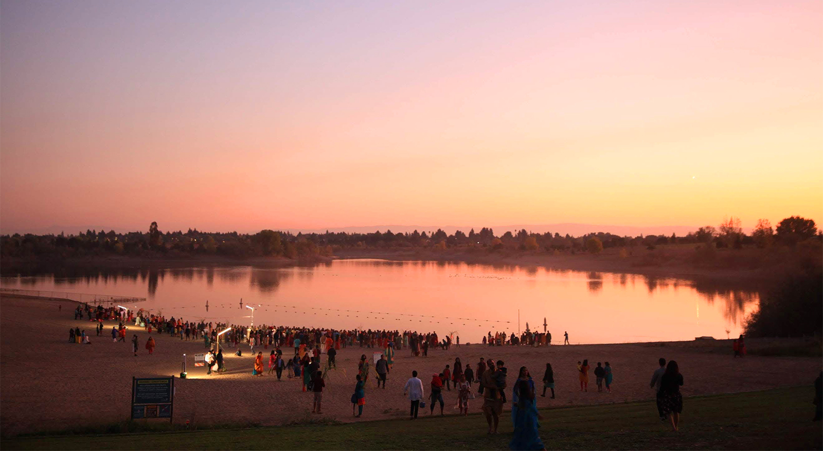 The sun sets during Chhath Puja events at Quarry Lakes Regional Recreation Area in Fremont, California, in Nov. 2019. (Photo courtesy Sunil and Shalini Singh)