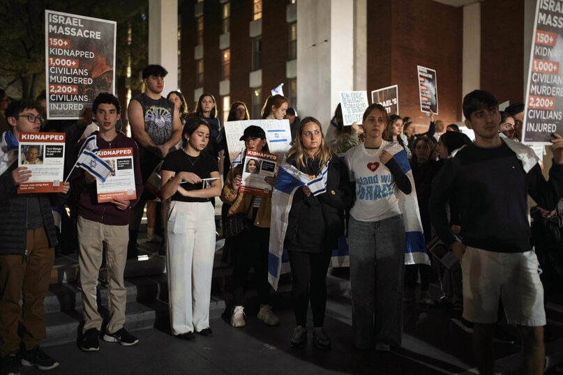 Jewish Rutgers University students and members of the community gather holding placards and flags in solidarity and vigil for Israel on Oct. 25, 2023, in New Brunswick, N.J. (AP Photo/Andres Kudacki)