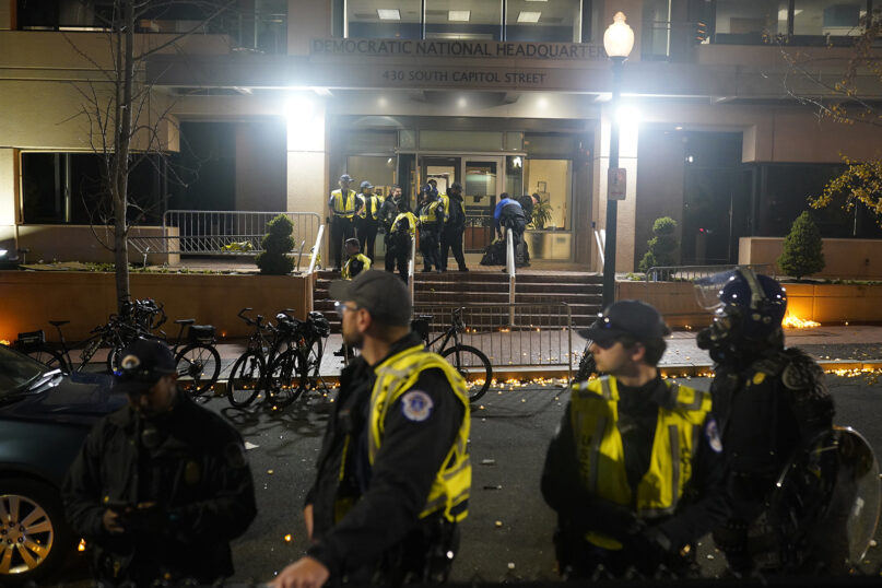 U.S. Capitol Police stand outside the headquarters of the Democratic National Committee in Washington, Wednesday, Nov. 15, 2023, after an Israel-Hamas war vigil turned violent.  (AP Photo/Nathan Howard)