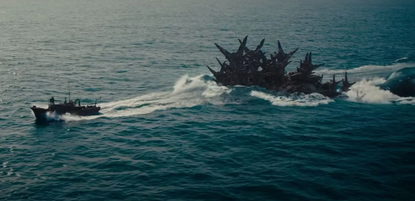Part of Godzilla appears behind a boat in "Godzilla Minus One." (Toho International)