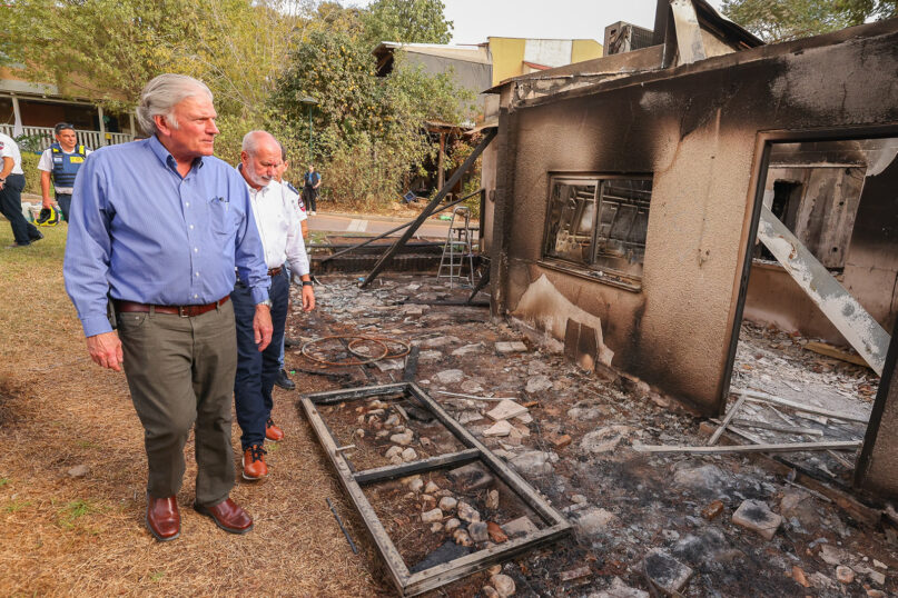 Franklin Graham, left, sees damage from the Oct. 7 Hamas attack while touring Kibbutz Be’eri in Israel. (Photo courtesy of Samaritan’s Purse)