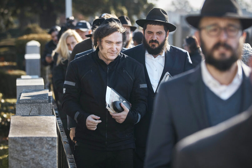 Argentina’s president-elect, Javier Milei, center left, leaves after praying next to Chabad-Lubavitch rabbis at the resting place of Rabbi Menachem Mendel Schneerson at Montefiore Cemetery, Nov. 27, 2023, in the Queens borough of New York. (AP Photo/Andres Kudacki)