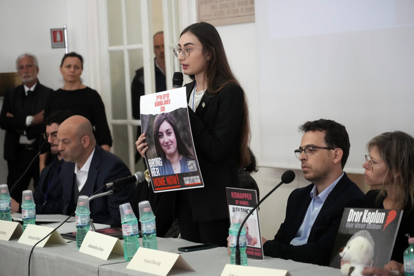 Alexandra Ariev, center, speaks during a news conference at the Italian Jewish Center in Rome, Nov. 22, 2023, with other representatives of the families of Israelis abducted by Hamas on Oct. 7, 2023, and believed to be held hostage in Gaza. The news conference was held shortly after the families met with Pope Francis at the Vatican. Ariev’s sister, an Israeli soldier, was abducted from her base during the Oct. 7 attack. (AP Photo/Gregorio Borgia)