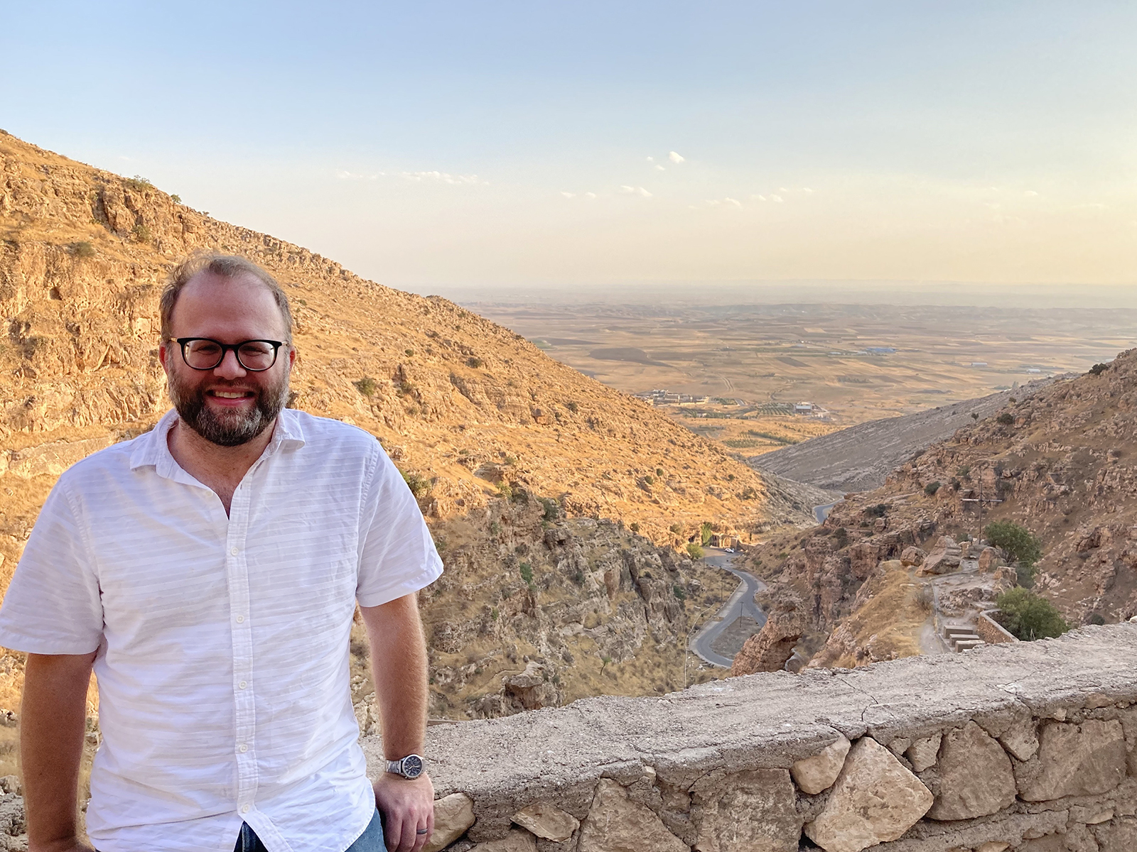 Shane Liesegang poses at the Rabban Hormizd Monastery in Alqosh, Iraq, overlooking the Nineveh Plains. (Photo courtesy Liesegang)
