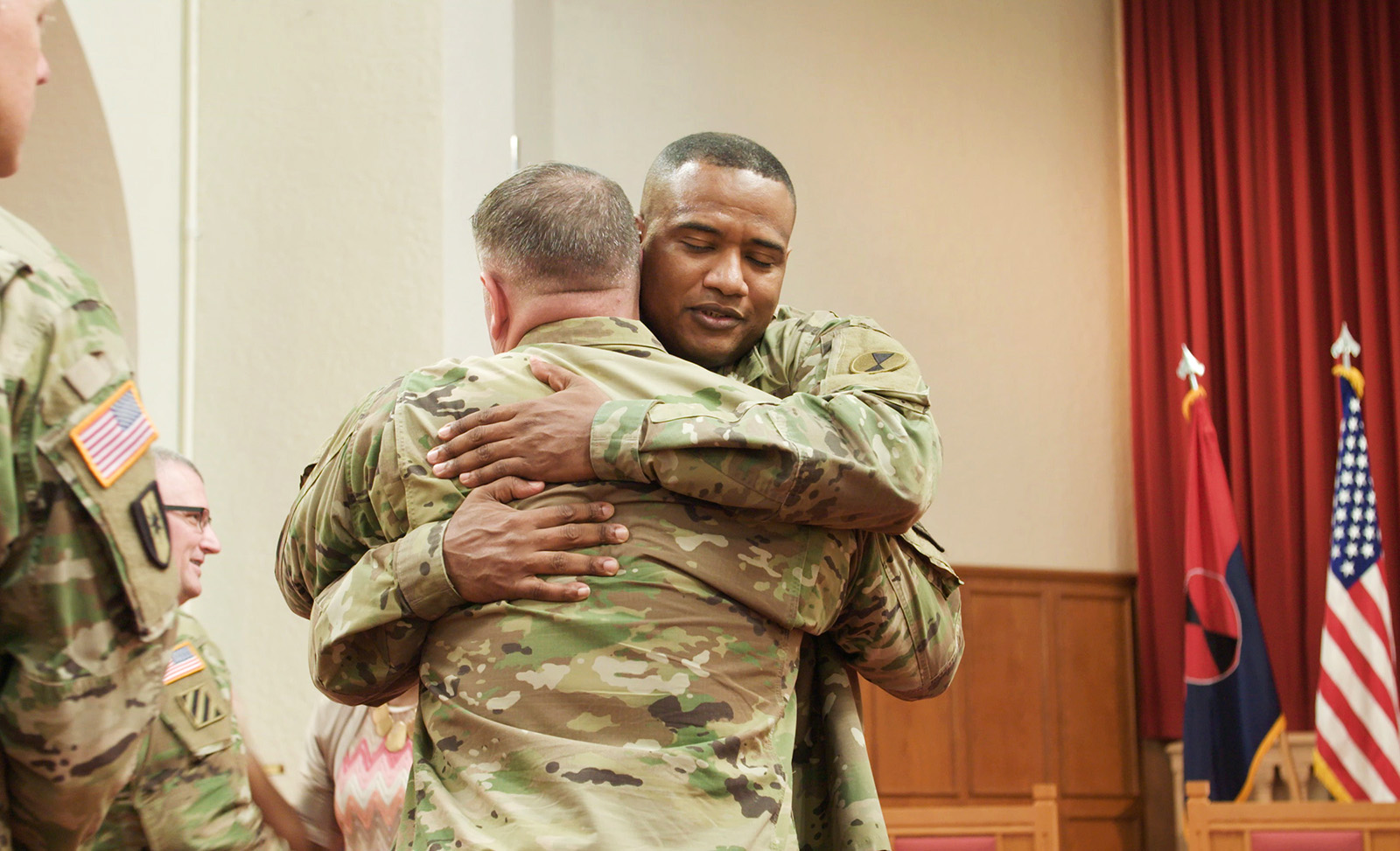 Khallid Shabazz hugs a soldier at Joint Base Lewis-McChord near Tacoma, Washington. (Photo by David Washburn)