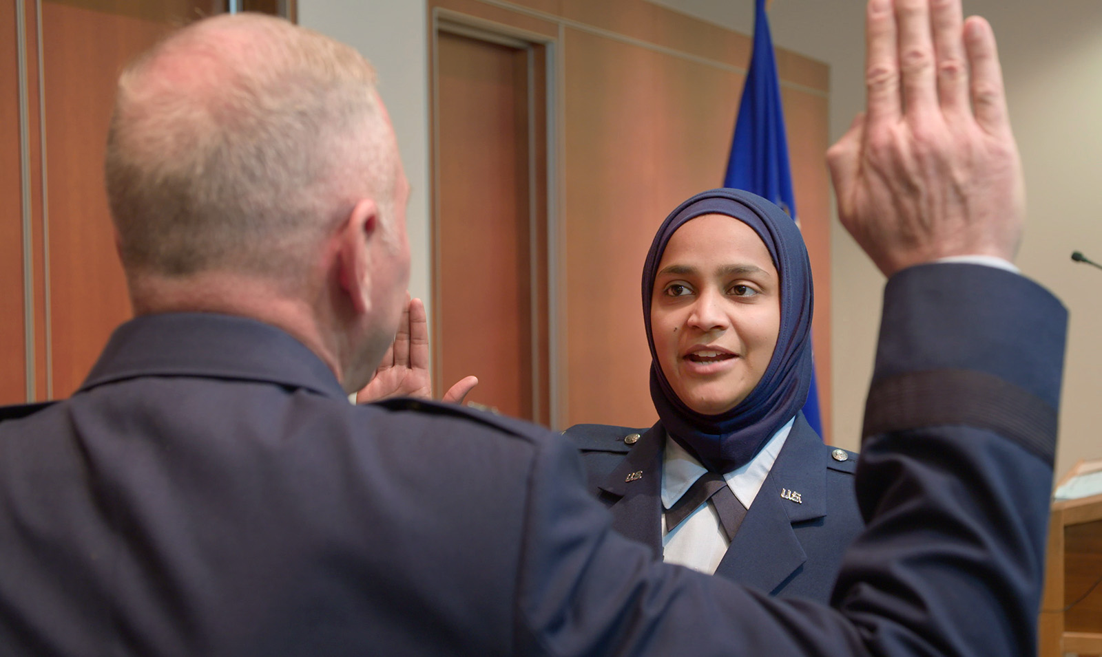 Saleha Jabeen takes the oath to enter the Air Force chaplain corps, at Catholic Theological Union in Chicago. (Photo by David Washburn)