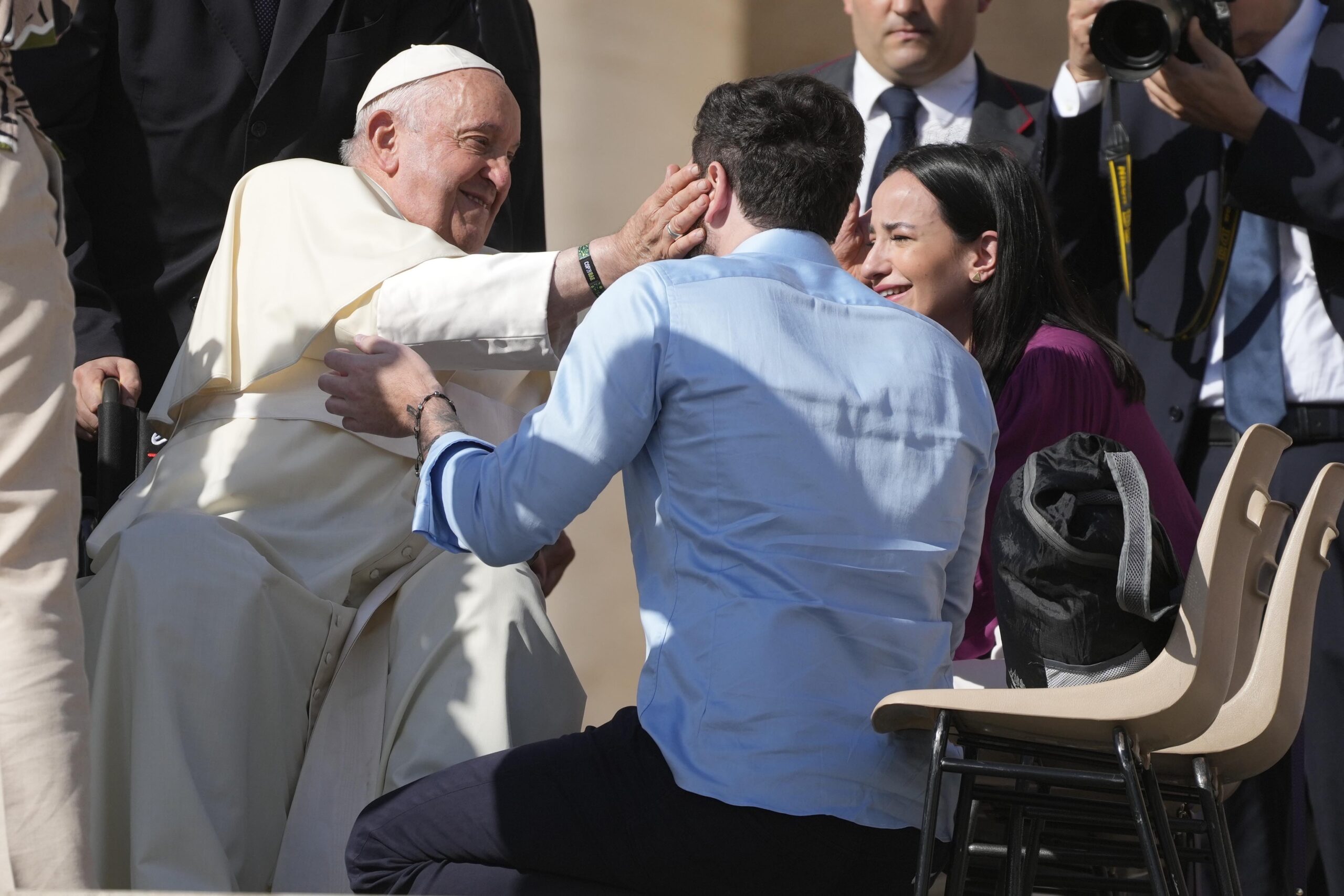 FILE - Newlywed couples meet with Pope Francis during the weekly general audience in St. Peter's Square at the Vatican, on Oct. 11, 2023. Pope Francis has formally approved allowing priests to bless same-sex couples, with a new document released Monday Dec. 18, 2023 explaining a radical change in Vatican policy by insisting that people seeking God’s love and mercy shouldn’t be subject to “an exhaustive moral analysis” to receive it. (AP Photo/Gregorio Borgia, File)
