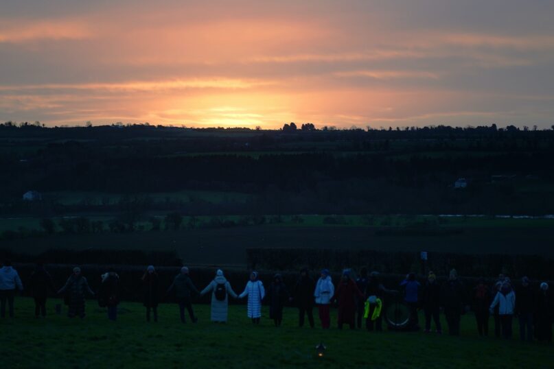 People gather for Pagan sunrise celebrations in Ireland, on the morning of the winter solstice. (Brian Lawless/PA Images via Getty Images)