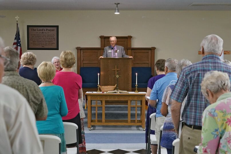 FILE - The Rev. Bill Farmer, center, speaks to members of the congregation during service at the Grace Methodist Church Sunday, May 14, 2023, in Homosassa Springs, Fla. The new congregation was created by former United Methodists after their previous congregation voted to stay in that denomination. Grace Church affiliated with the more conservative Global Methodist Church. A quarter of U.S. congregations in the United Methodist Church have received permission to leave the denomination during a five-year window, closing in December 2023, that authorized departures for congregations over disputes involving the church's LGBTQ-related policies. (AP Photo/Chris O'Meara, File)