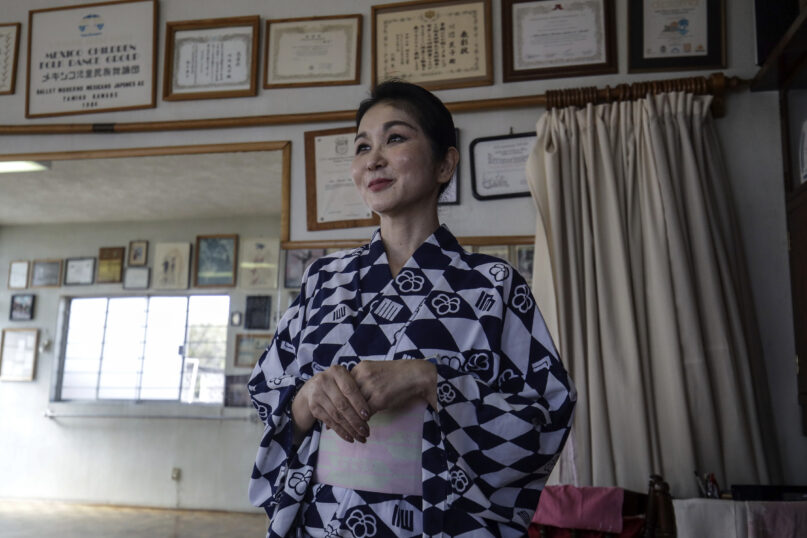 Professor Naoko Kihara, who has practiced Hanayagi-style dance for over two decades, stands in her studio during an interview in Mexico City, Wednesday, Nov. 22, 2023. Born in Brazil from Japanese parents who later moved to Mexico City, she carries on the legacy of Tamiko Kawabe, her mentor and pioneer of Hanayagi-style dance. (AP Photo/Ginnette Riquelme)