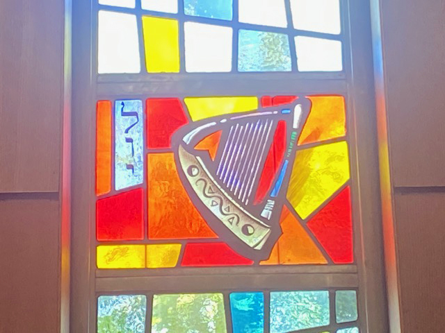 Detail of the tribe of Levi, the musicians, from the stained glass windows at the Marathon Jewish Community Center in Douglaston, Queens, New York. (Photo courtesy Shira Dicker)