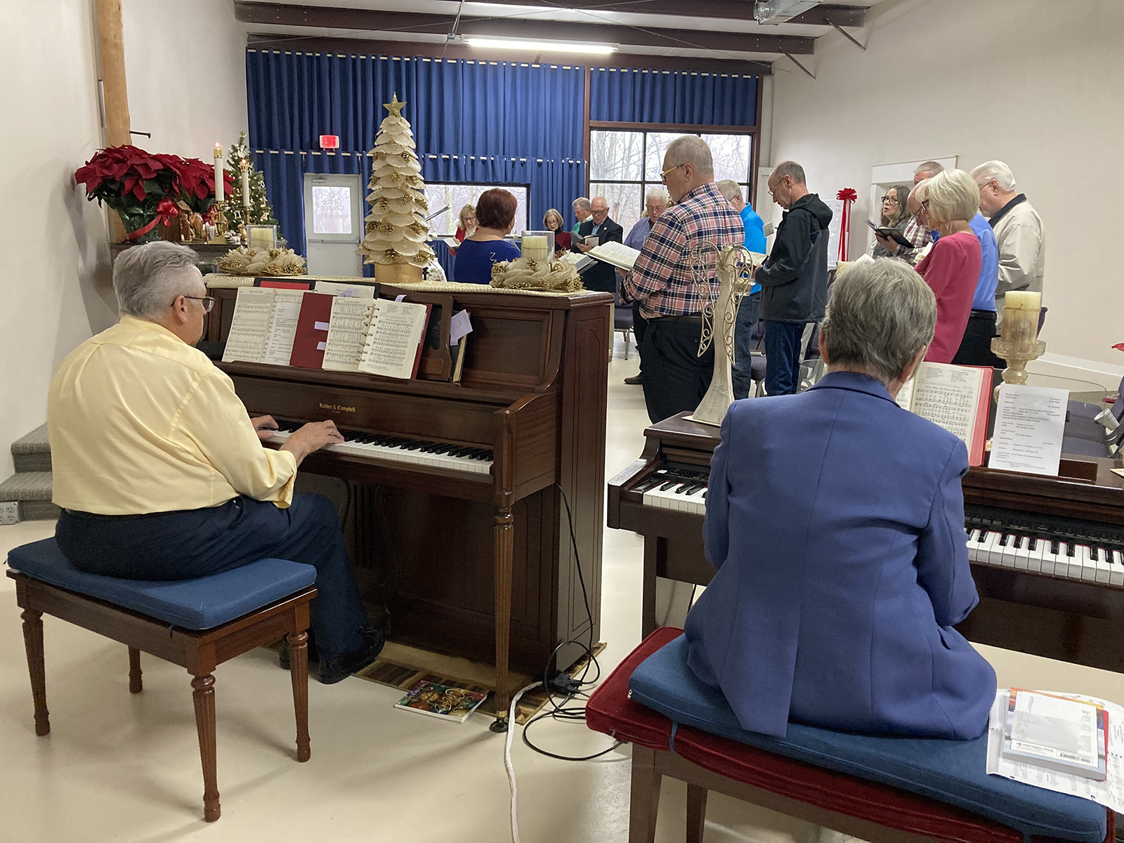 Jim Wilson at the piano, left, and June Buzzard at the organ, right, lead Grace United Methodist Mission in music, Sunday, Dec. 3, 2023, in on Dec. 3, 2023, in Advance, North Carolina. (RNS photo/Yonat Shimron)