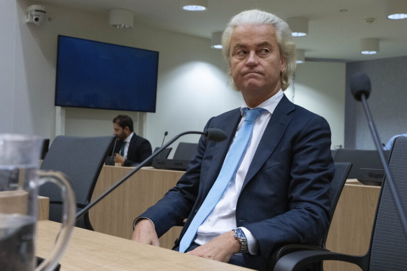 FILE - Politician Geert Wilders listenes, as the court delivers it's verdict against a former Pakistan cricketer accused of incitement to kill, at the high security court building near Schiphol airport, Monday, Sept. 11, 2023.  Far right Dutch election winner Geert Wilders on Monday withdrew proposed legislation calling for a ban on mosques and the Quran — in a concession to potential coalition partners a day before talks to form the next government were set to resume. (AP Photo/Peter Dejong), File)