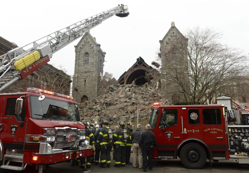 Emergency crews respond to the former First Congregational church after the steeple of the old, historic church collapsed, Thursday, Jan. 25, 2024, in New London, Conn. (Dana Jensen/The Day via AP)