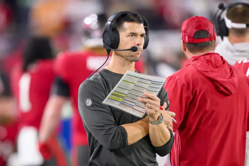 Tampa Bay Buccaneers offensive coordinator Dave Canales holds the play sheet on the sidelines during an NFL wild-card playoff football game against the Philadelphia Eagles, Monday, Jan. 15, 2024 in Tampa, Fla. (AP Photo/Doug Murray, File)
