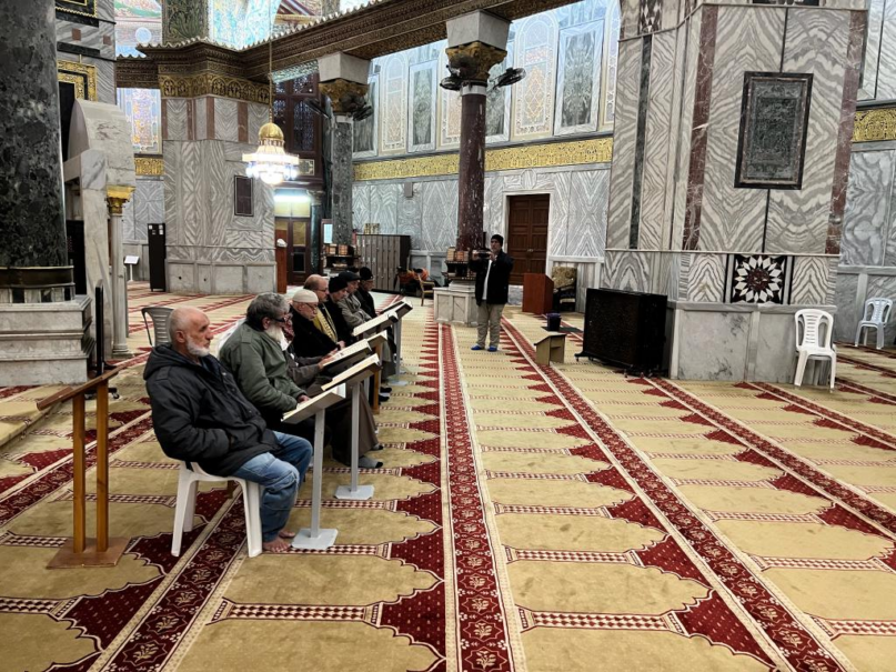 A small number of elderly men study Quran around the Fajr congregational prayer time in the Dome of the Rock. (Photo by Dilshad Ali)