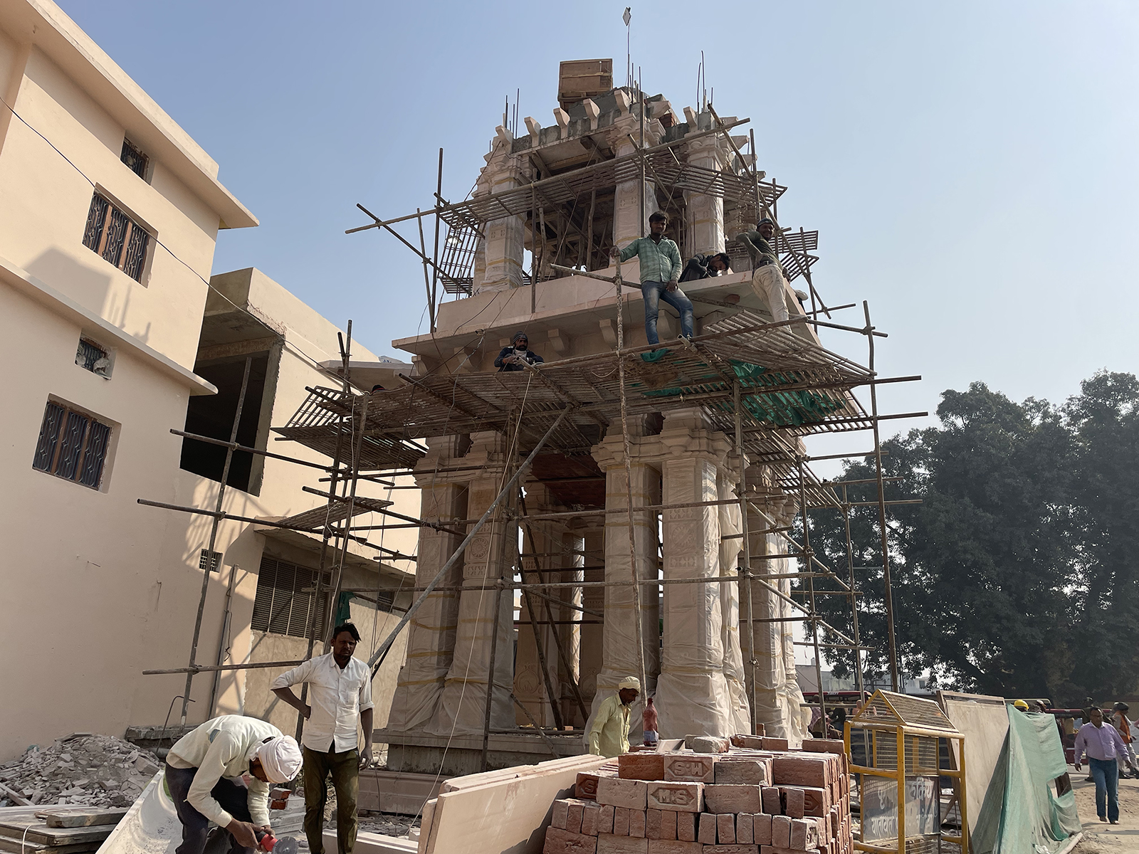 Laborers work on the entrance to the new Ram Mandir, a Hindu temple dedicated to Lord Ram, in Ayodhya, India. (RNS photo/Richa Karmarkar)
