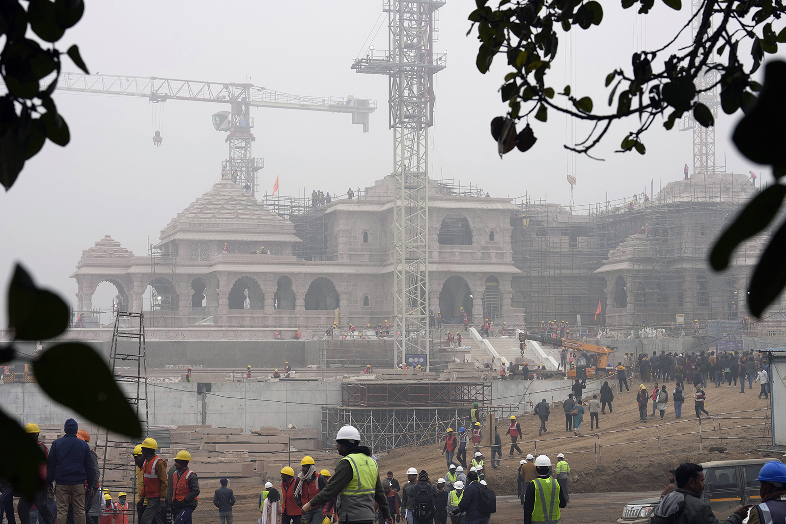 Construction crews work on Ram Mandir, a Hindu temple dedicated to Lord Ram, being built at the site of the demolished Babri Masjid mosque in Ayodhya, India, Friday, Dec. 29, 2023. The 16th century mosque was destroyed by Hindu radicals in December 1992, sparking massive Hindu-Muslim violence that left some 2,000 people dead. The Supreme Court's verdict allowed a temple to be built in place of the demolished mosque. (AP Photo/Rajesh Kumar Singh)