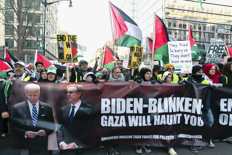 Anti-war activists march to the White House during a pro-Palestinian demonstration demanding a cease-fire in Gaza, at Freedom Plaza in Washington, Saturday, Jan. 13, 2024. (AP Photo/Jose Luis Magana)