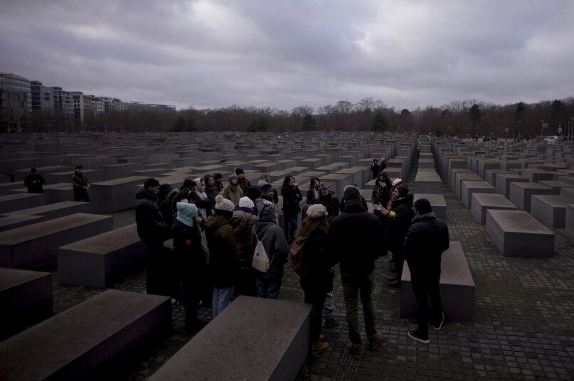 Tourists visit the Holocaust Memorial in Berlin, Germany, on International Holocaust Remembrance Day, Saturday, Jan. 27, 2024. The International Holocaust Remembrance Day marks the anniversary of the liberation of the Nazi death camp Auschwitz - Birkenau on Jan. 27, 1945. (AP Photo/Markus Schreiber)