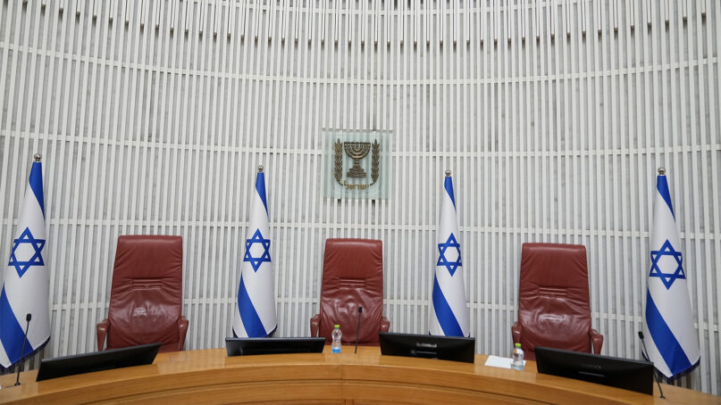 The justices' bench in the Supreme Court of Israel, is seen ahead of a hearing on a petition against a law that limits removal of a prime minister from office due to medical and mental incapacitation, which makes forcing Prime Minister Benjamin Netanyahu from office over a conflict of interest while on trial for corruption more difficult, in Jerusalem, Thursday, Aug. 3, 2023. (AP Photo/Ohad Zwigenberg)