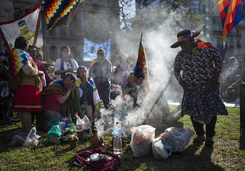 Indigenous leaders from the province of Jujuy perform a ceremony in front of the Palace of Justice during celebrations of 
