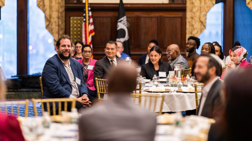 Jason Holtzman, left, attends an interfaith iftar with many religious leaders and government officials at Philadelphia City Hall on April 20, 2023. (Photo courtesy of PIIPA)
