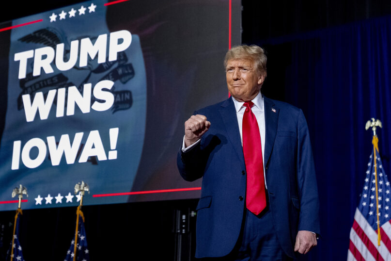 Republican presidential candidate and former President Donald Trump takes the stage at a caucus night party in Des Moines, Iowa, Jan. 15, 2024. (AP Photo/Andrew Harnik)