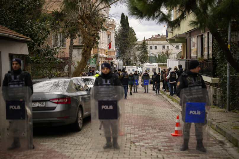 Turkish police officers guard a cordoned off area outside Santa Maria Catholic Church in Istanbul, Turkey, Sunday, Jan. 28, 2024. Two masked assailants attacked the church in Istanbul during Sunday services, killing one person, Turkish officials said. (AP Photo/Emrah Gurel)