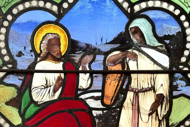 A detail of a nearly 150-year-old stained-glass window depicts Christ speaking to a Samaritan woman, in the now-closed St. Mark’s Episcopal church, Monday, May 1, 2023, in Warren, R.I. (AP Photo/Mark Pratt, File)