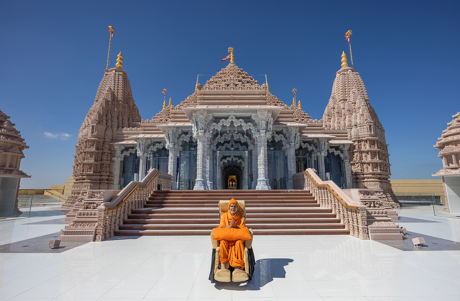 His Holiness Mahant Swami Maharaj poses in front of BAPS Hindu Mandir of Abu Dhabi. (Photo courtesy BAPS Hindu Mandir of Abu Dhabi)