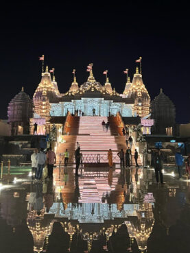 The BAPS Hindu Mandir of Abu Dhabi is reflected in water. (Photo courtesy BAPS Hindu Mandir of Abu Dhabi)