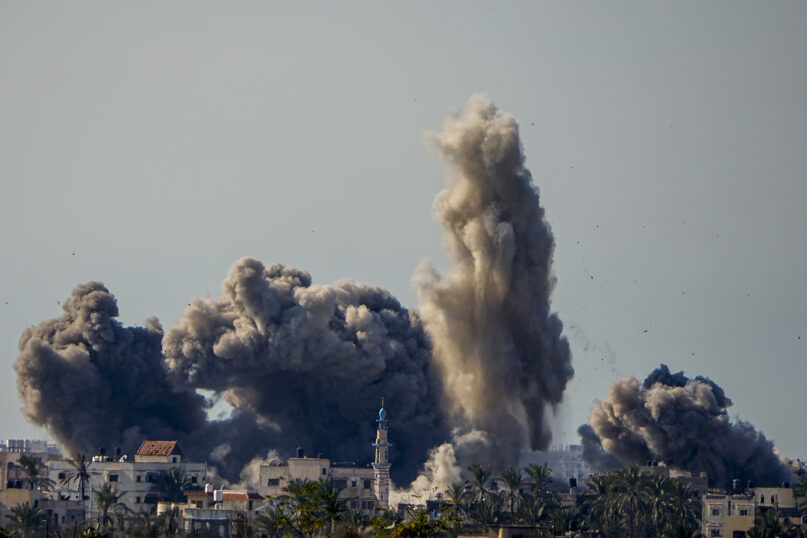 Smoke and explosions following an Israeli bombardment inside the Gaza Strip, as seen from southern Israel, Sunday, Feb. 11, 2024. (AP Photo/Ariel Schalit)